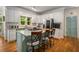 Bright kitchen boasts granite countertops, stainless appliances, and a center island with seating at 1061 Polo Club Nw Dr, Marietta, GA 30064