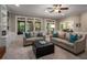 Inviting living room with built-in shelving, plush seating, and large windows for natural light at 1061 Polo Club Nw Dr, Marietta, GA 30064