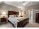 Comfortable main bedroom with a serene atmosphere, soft lighting, and ensuite bathroom access creating a peaceful retreat at 1061 Polo Club Nw Dr, Marietta, GA 30064