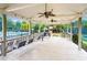 Outdoor patio with ceiling fans, chairs, and view of the pool and playground at 1061 Polo Club Nw Dr, Marietta, GA 30064