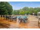 Pool deck with tables and chairs, with a view of the pool and playground at 1061 Polo Club Nw Dr, Marietta, GA 30064