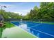 Community tennis court with benches at 1061 Polo Club Nw Dr, Marietta, GA 30064