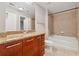 Bathroom with granite countertop vanity, a bathtub, and a shower at 3324 Peachtree Ne Rd # 1407, Atlanta, GA 30326