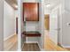 Hallway with built-in desk and open bathroom at 3324 Peachtree Ne Rd # 1407, Atlanta, GA 30326
