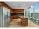 Modern kitchen with wood cabinets, stainless appliances, and an island, all with a fantastic city view at 3324 Peachtree Ne Rd # 1407, Atlanta, GA 30326