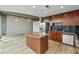 Spacious kitchen with stainless steel appliances, a center island, and an open living space at 3324 Peachtree Ne Rd # 1407, Atlanta, GA 30326