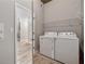 Laundry room features white washer and dryer with wood-look floors at 3324 Peachtree Ne Rd # 1407, Atlanta, GA 30326