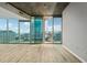 Spacious living room featuring modern lighting, hardwood floors, and large windows offering panoramic city views at 3324 Peachtree Ne Rd # 1407, Atlanta, GA 30326