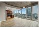 Bright, open living area with floor-to-ceiling windows and city views, seamlessly flowing into the kitchen at 3324 Peachtree Ne Rd # 1407, Atlanta, GA 30326