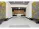 Bright lobby featuring tile floors, modern lighting, and decorative stone walls with built-in benches for welcoming residents at 3324 Peachtree Ne Rd # 1407, Atlanta, GA 30326
