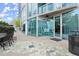 Modern patio featuring an outside table and chairs with a partial building view at 3324 Peachtree Ne Rd # 1407, Atlanta, GA 30326