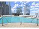 Rooftop pool with city views, sun loungers, and clear blue water at 3324 Peachtree Ne Rd # 1407, Atlanta, GA 30326
