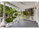 Spacious back porch with a view of the landscaped yard and a white picket fence at 3848 Saint Annes Ct, Duluth, GA 30096