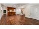 Finished basement featuring hardwood flooring, wet bar, white trim, and stairwell at 3848 Saint Annes Ct, Duluth, GA 30096
