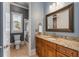 Bathroom featuring granite countertop vanity, framed mirror, window and shower stall at 3848 Saint Annes Ct, Duluth, GA 30096