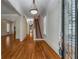 Inviting foyer with hardwood floors and staircase with patterned runner at 3848 Saint Annes Ct, Duluth, GA 30096