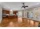 Spacious kitchen with wood cabinets, kitchen island, stainless steel appliances, and hardwood floors at 3848 Saint Annes Ct, Duluth, GA 30096