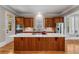 Well-equipped kitchen with large center island, stainless steel appliances, and custom cabinets at 3848 Saint Annes Ct, Duluth, GA 30096