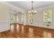 Open-concept living space with hardwood floors and natural light at 3848 Saint Annes Ct, Duluth, GA 30096