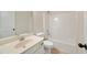 Clean and well-maintained bathroom features a shower-tub combination and vanity at 516 Winder Trl, Canton, GA 30114