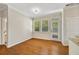 Eat-in dining area features hardwood floors, white trim and lots of windows at 516 Winder Trl, Canton, GA 30114