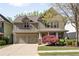 Charming two-story home with a two-car garage and inviting front yard landscaping at 516 Winder Trl, Canton, GA 30114