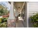 Front porch with stone and siding columns and professionally landscaped yard at 516 Winder Trl, Canton, GA 30114