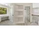 Upstairs landing area with custom shelving, and built-in desk niche near the window at 516 Winder Trl, Canton, GA 30114