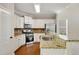 Bright kitchen featuring white cabinetry, stainless steel appliances, and granite countertops at 516 Winder Trl, Canton, GA 30114