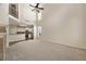Open-concept living room showcasing tall ceilings flowing into a modern kitchen and upper loft at 516 Winder Trl, Canton, GA 30114