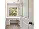 Bright office featuring custom built-ins and a picture window overlooking lush greenery at 516 Winder Trl, Canton, GA 30114