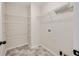 Walk-in pantry with vinyl tile floors, shelving, and utility hookups at 516 Winder Trl, Canton, GA 30114