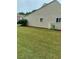 Backyard featuring a well-maintained lawn and utility structure at 636 North Ave # H-10, Jonesboro, GA 30236