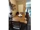Dining area with wooden table and chairs, plus decorative accents at 636 North Ave # H-10, Jonesboro, GA 30236