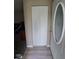 Entryway featuring a bi-fold closet and stylish front door at 636 North Ave # H-10, Jonesboro, GA 30236