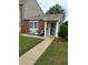 Inviting front porch with chairs, table, and vibrant flower accents at 636 North Ave # H-10, Jonesboro, GA 30236