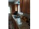 Kitchen featuring stainless steel sink and wooden cabinets at 636 North Ave # H-10, Jonesboro, GA 30236