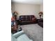 Cozy living room with comfortable leather furniture and carpet at 636 North Ave # H-10, Jonesboro, GA 30236