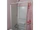 Bathroom shower and curtain featuring light pink accents and a detachable shower head at 636 North Ave # H-10, Jonesboro, GA 30236