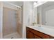 Bright bathroom featuring a glass-enclosed shower and a modern vanity at 325 Cranbrooke Cir, Suwanee, GA 30024