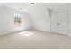 Bright, carpeted bedroom with a window view and a double-door closet at 325 Cranbrooke Cir, Suwanee, GA 30024