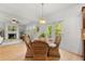 Bright dining area with a view of the wooded backyard at 325 Cranbrooke Cir, Suwanee, GA 30024