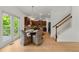 Charming dining area with a view of the wooded backyard at 325 Cranbrooke Cir, Suwanee, GA 30024