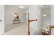 Bright upstairs hallway with a view of the dining area at 325 Cranbrooke Cir, Suwanee, GA 30024