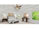 Serene main bedroom with tray ceiling, accent wall, and ample natural light at 325 Cranbrooke Cir, Suwanee, GA 30024