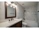 Bathroom featuring modern fixtures, a new vanity, and a shower-tub combo with decorative tile at 3563 Brenda Ct, Douglasville, GA 30135