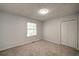 Bedroom featuring wall-to-wall carpet, a storage closet, and a window for natural light at 3563 Brenda Ct, Douglasville, GA 30135