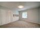 Bedroom featuring wall-to-wall carpet, a storage closet, and a window for natural light at 3563 Brenda Ct, Douglasville, GA 30135