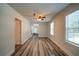 Bonus room with closet, ceiling fan, and view of backyard through windows at 3563 Brenda Ct, Douglasville, GA 30135