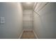 Walk-in closet featuring shelving and neutral carpet at 3563 Brenda Ct, Douglasville, GA 30135